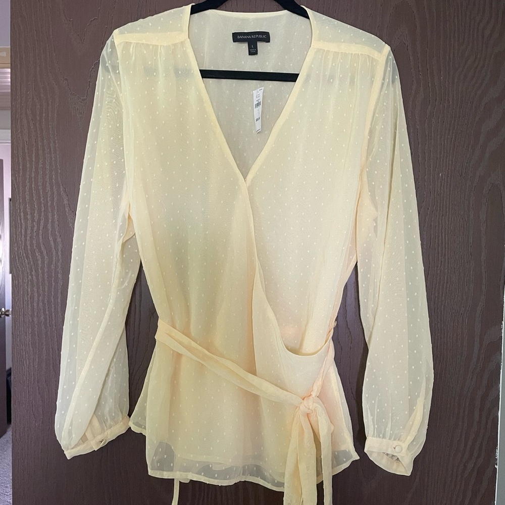 NWT. Never worn. Cute light yellow top from Banana Republic.